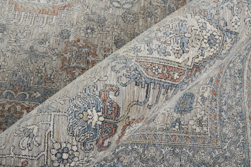 7' X 10' Silver Taupe and Blue Oriental Power Loom Worn Faded Area Rug With Fringe